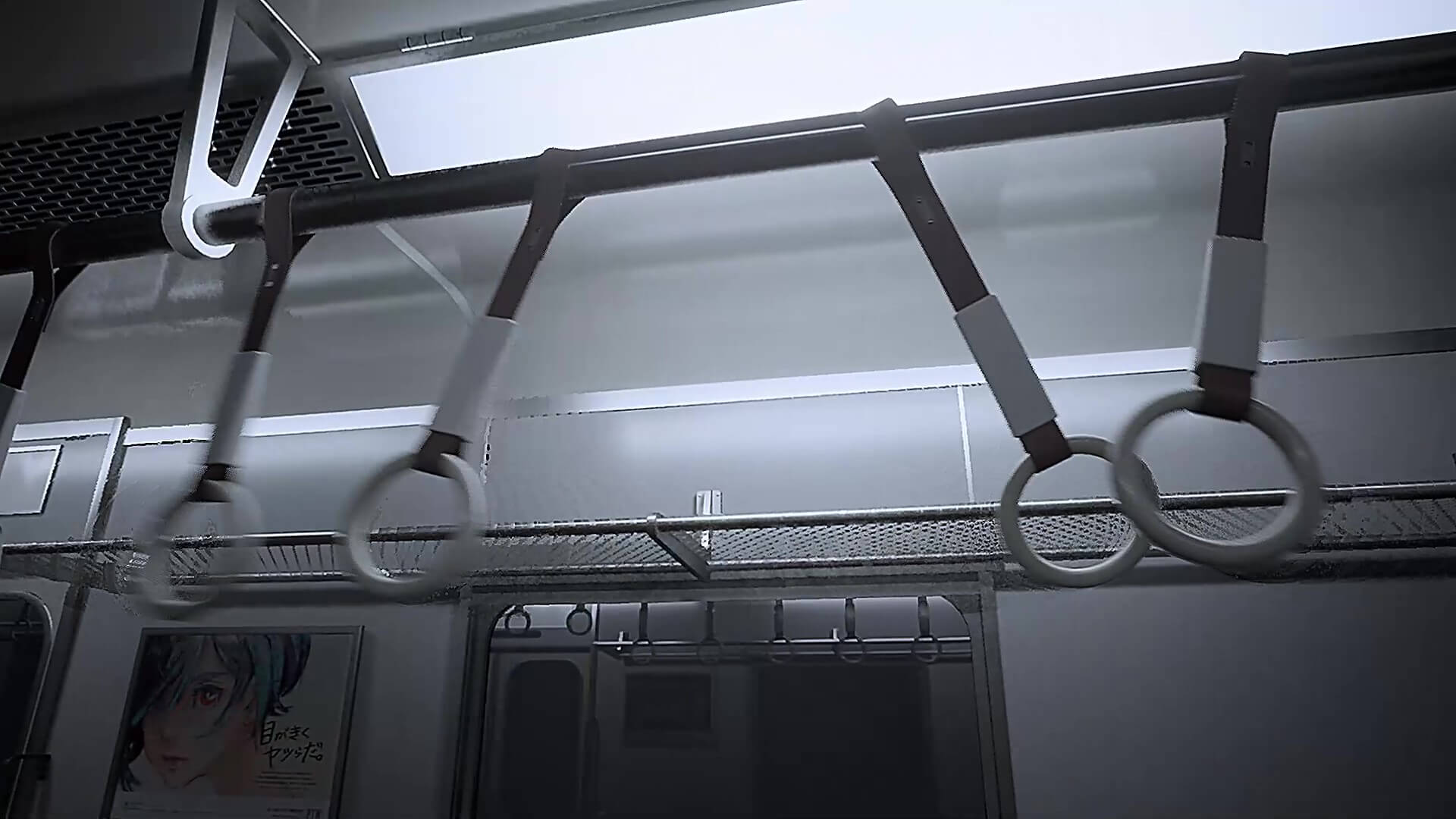 吊り革が揺れている