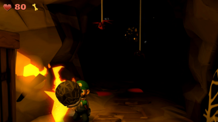 糸玉を松明で燃やす