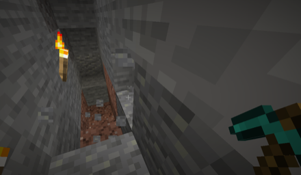 ツルハシで石を掘る