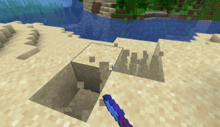 シャベルで土砂を取る