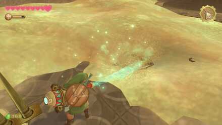 まほうのツボで砂を吹き飛ばす