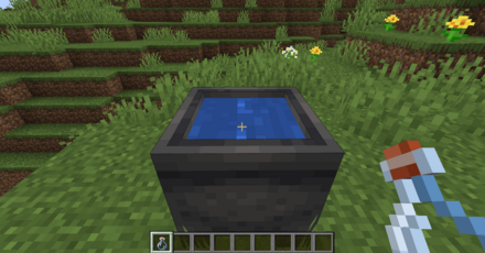 瓶を大釜に右クリックしてる様子