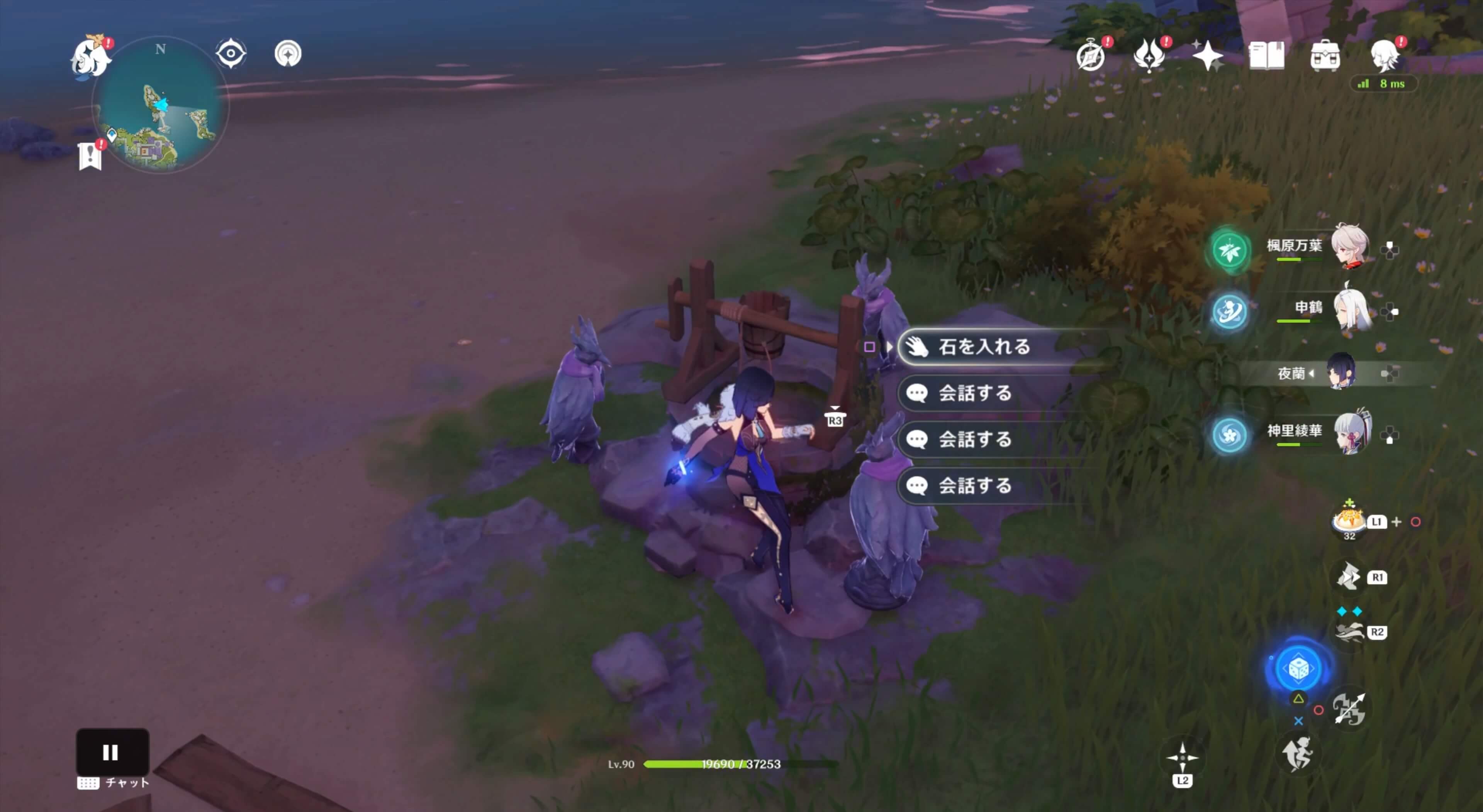 井戸に石を入れる