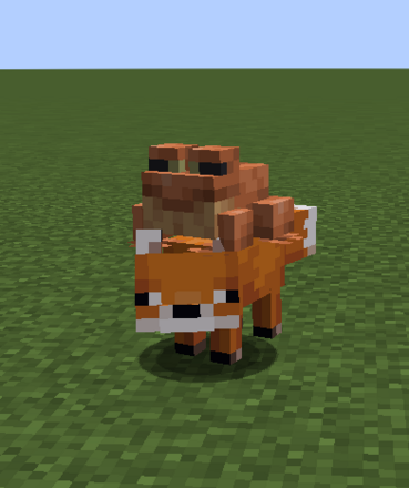 キツネに乗るカエル