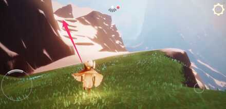 雪と草の境目辺りで崖を登っていく