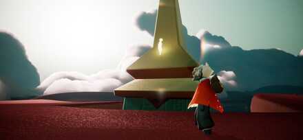 建物の最上部辺りに光の子を発見